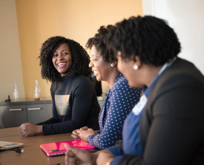 group of smiling female co-workers